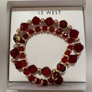 Nine West brand beautiful gold tone with red stones bracelet